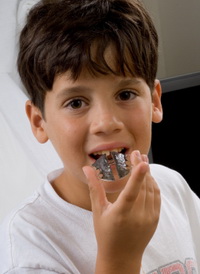 Boy with retainer - Pediatric Dentist in Keller, Fort Worth and Southlake, TX - Bridget McAnthony, DDS
