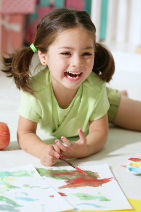 Girl laughing and painting - Pediatric Dentist in Keller, Fort Worth and Southlake, TX - Bridget McAnthony, DDS