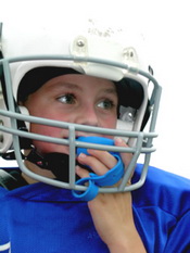 Child in helmet with mouth guard - Pediatric Dentist in Keller, Fort Worth and Southlake, TX - Bridget McAnthony, DDS